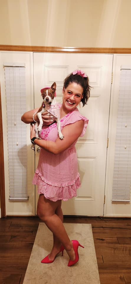 Teacher dressed as Barbie with her dog dressed as Ken