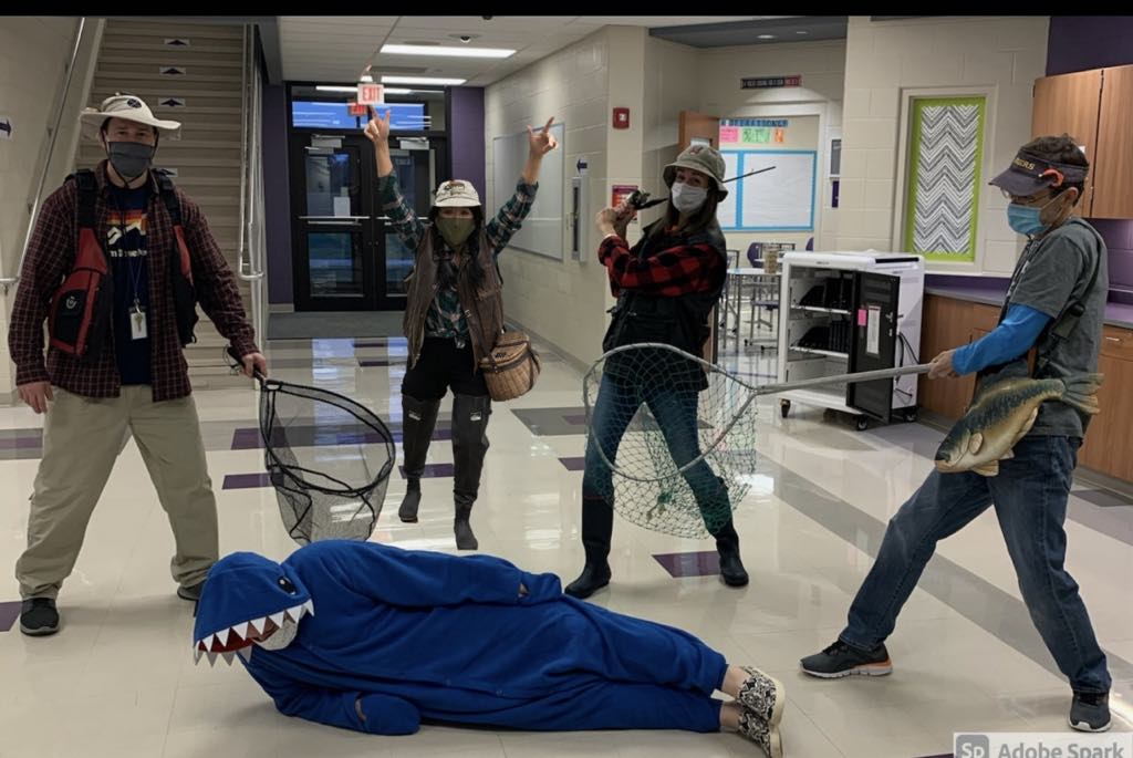 Teachers dressed as fishermen and one large fish