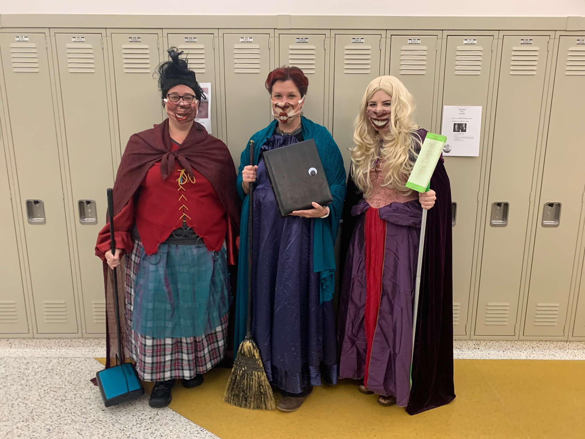 Three teachers dressed as the Sanderson sisters form the movie Hocus Pocus