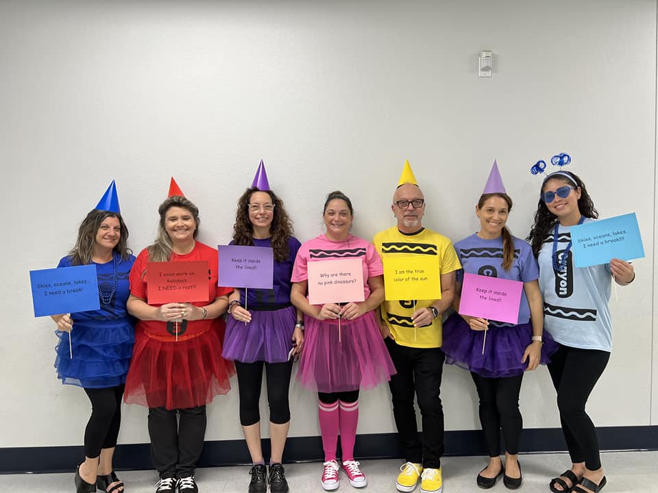 Teachers dressed a colorful crayons