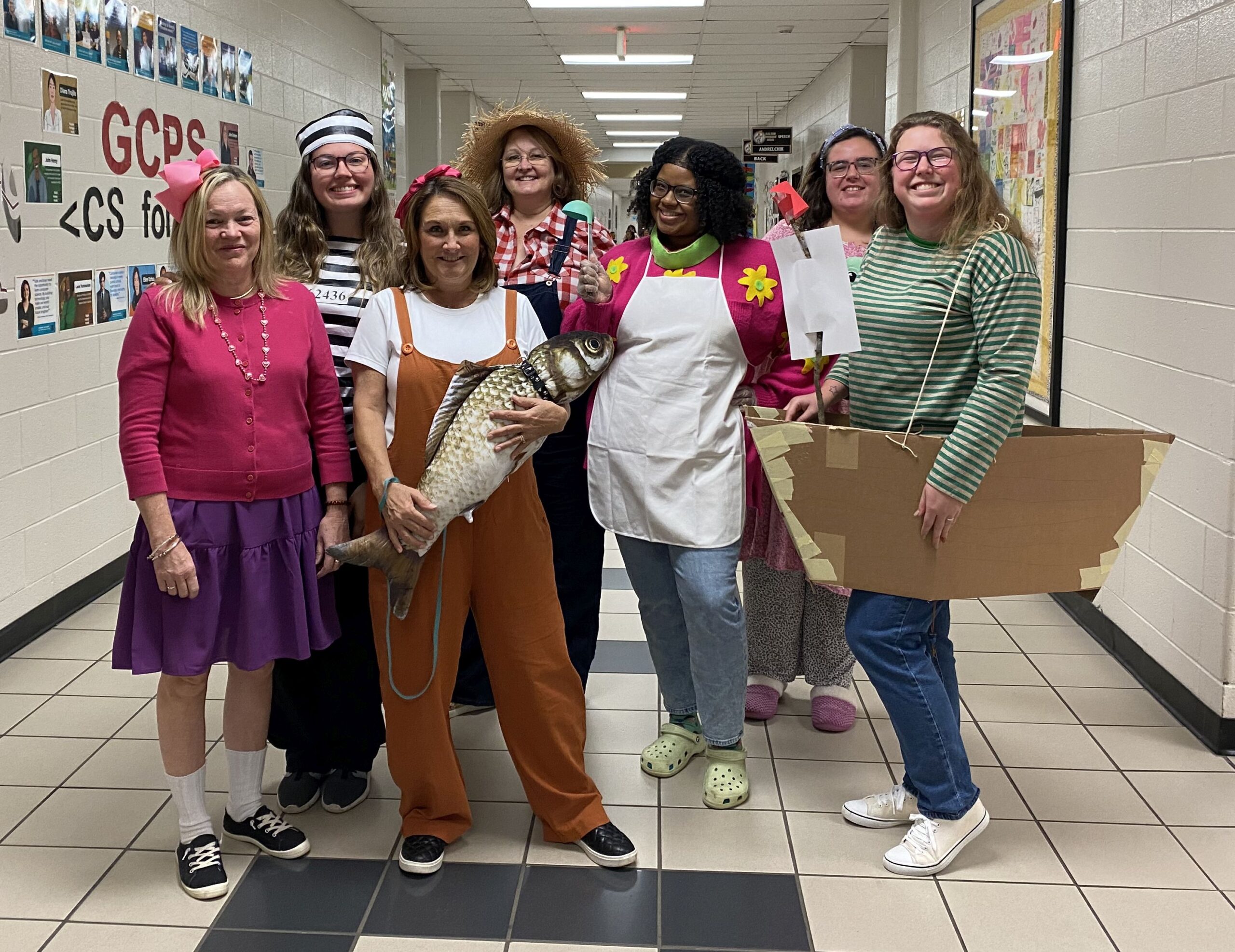 Group of teachers dressed as book character Junie B. Jones from different books