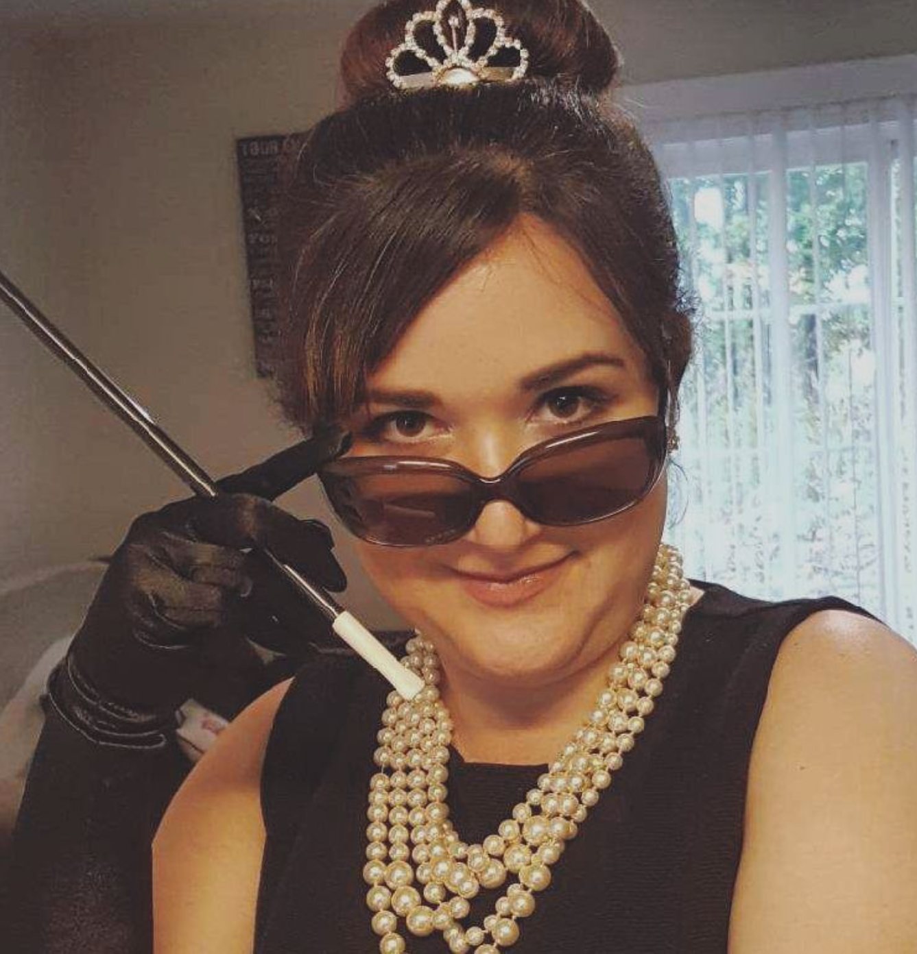 Teacher dressed as Holly Golightly from Breakfast at Tiffany's