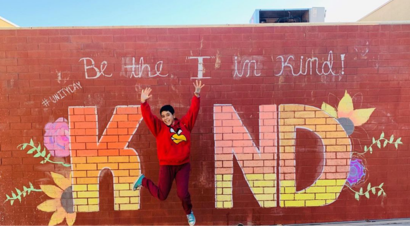 Painted unity wall that says Be the I in Kindness.