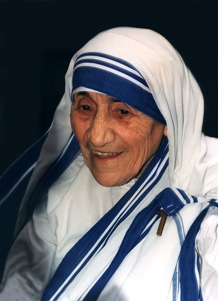 Mother Theresa wearing white and blue.